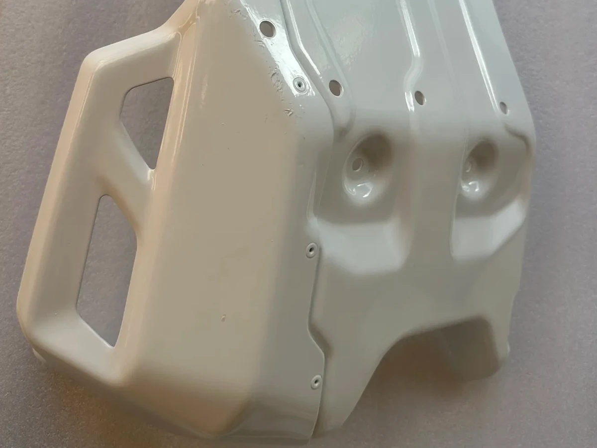 Off-white powder-coated metal housing with mounting holes and rectangular cutouts