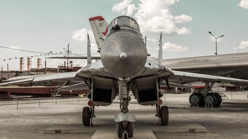 Front view of a military aircraft on outdoor display