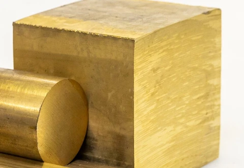 A rectangular brass billet with flat faces, square corners and visible cut marks