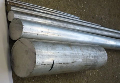 Long round metal bars with straight sides and visible circular ends