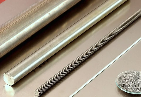 Long titanium bar stock displayed diagonally with a solid circular end
