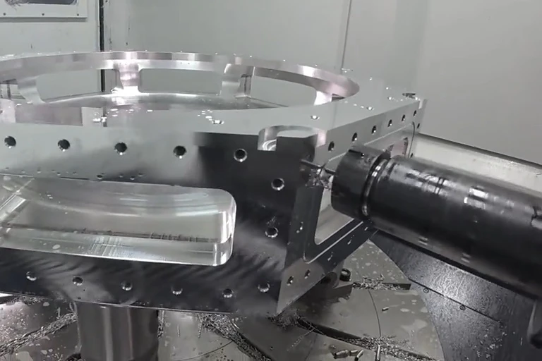 CNC spindle machining side features on a large metal housing with a circular opening
