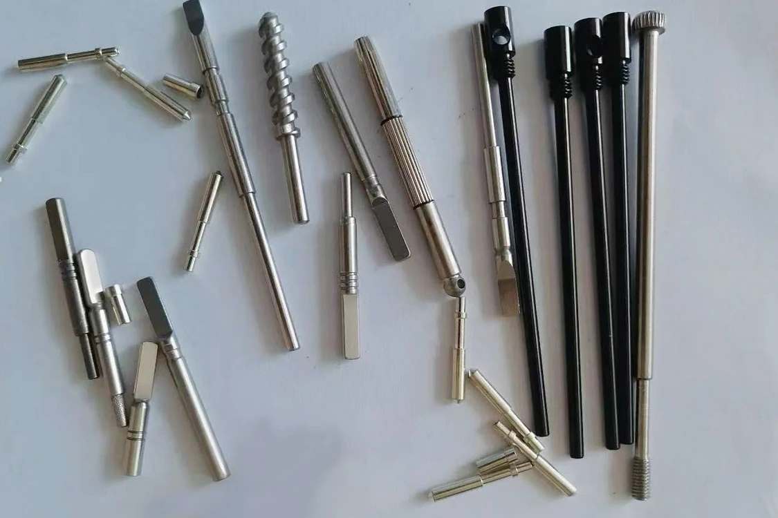 Slender machined shafts and metal components with threads, flats and knurled features